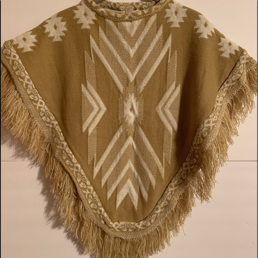 New Mudd poncho. This is small, fits to just above the elbow & to the waist.